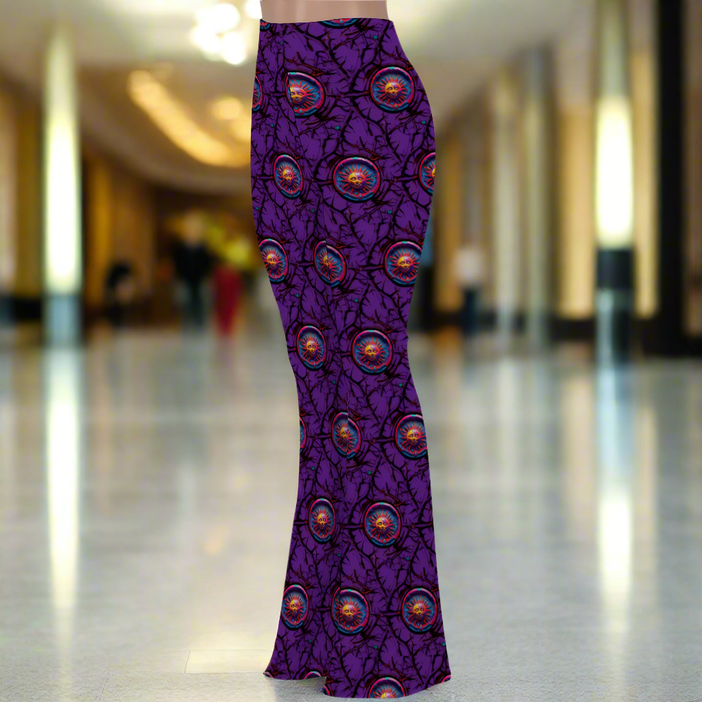 Stretch Bell Bottom Flare - Lunar Anarchy Purple pants featuring vibrant purple base with repeating circular pattern design in orange and black branch-like details. High-waisted, form-fitting design with dramatic flared legs showcasing an all-over gothic-inspired print perfect for fashion-forward styling.