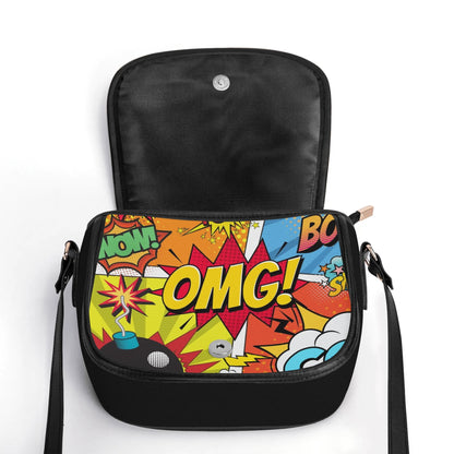 "The Comic saddle handbag with vibrant comic-style print, secure closure, and ample storage space for items."