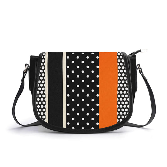 "Polkadot Sunset handbag featuring white dots and bold orange stripe, with sleek metal clasp closure."