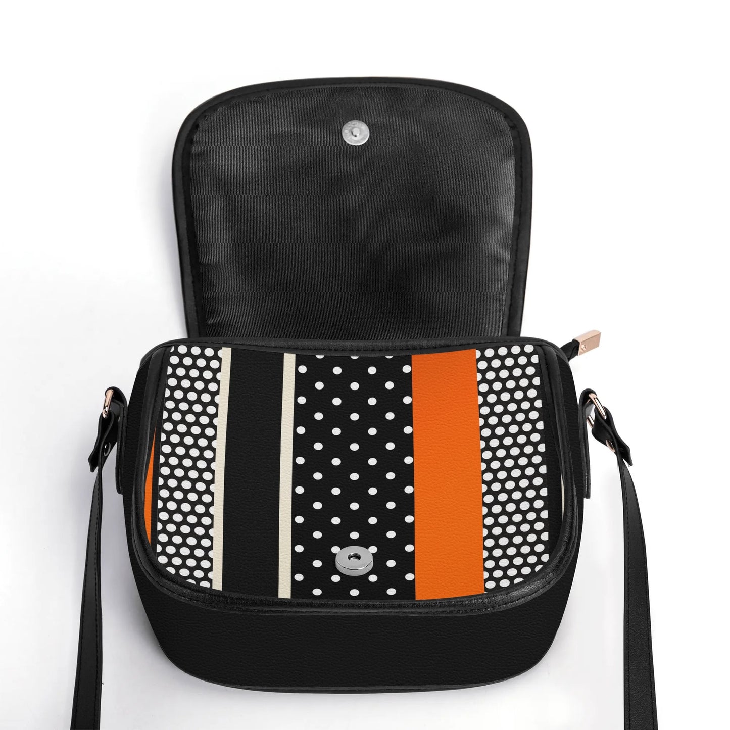 "Polkadot Sunset handbag featuring white dots and bold orange stripe, with sleek metal clasp closure."