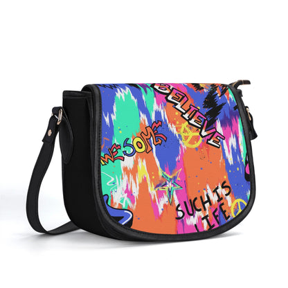 "Urban Graffiti saddle handbag with vibrant graffiti art, sleek design, and ample storage space."