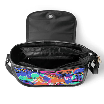 "Urban Graffiti saddle handbag with vibrant graffiti art, sleek design, and ample storage space."