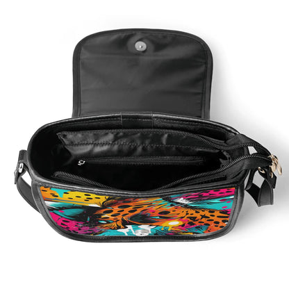 "Wild Leopard saddle handbag featuring abstract neon design with captivating eyes and secure closure."