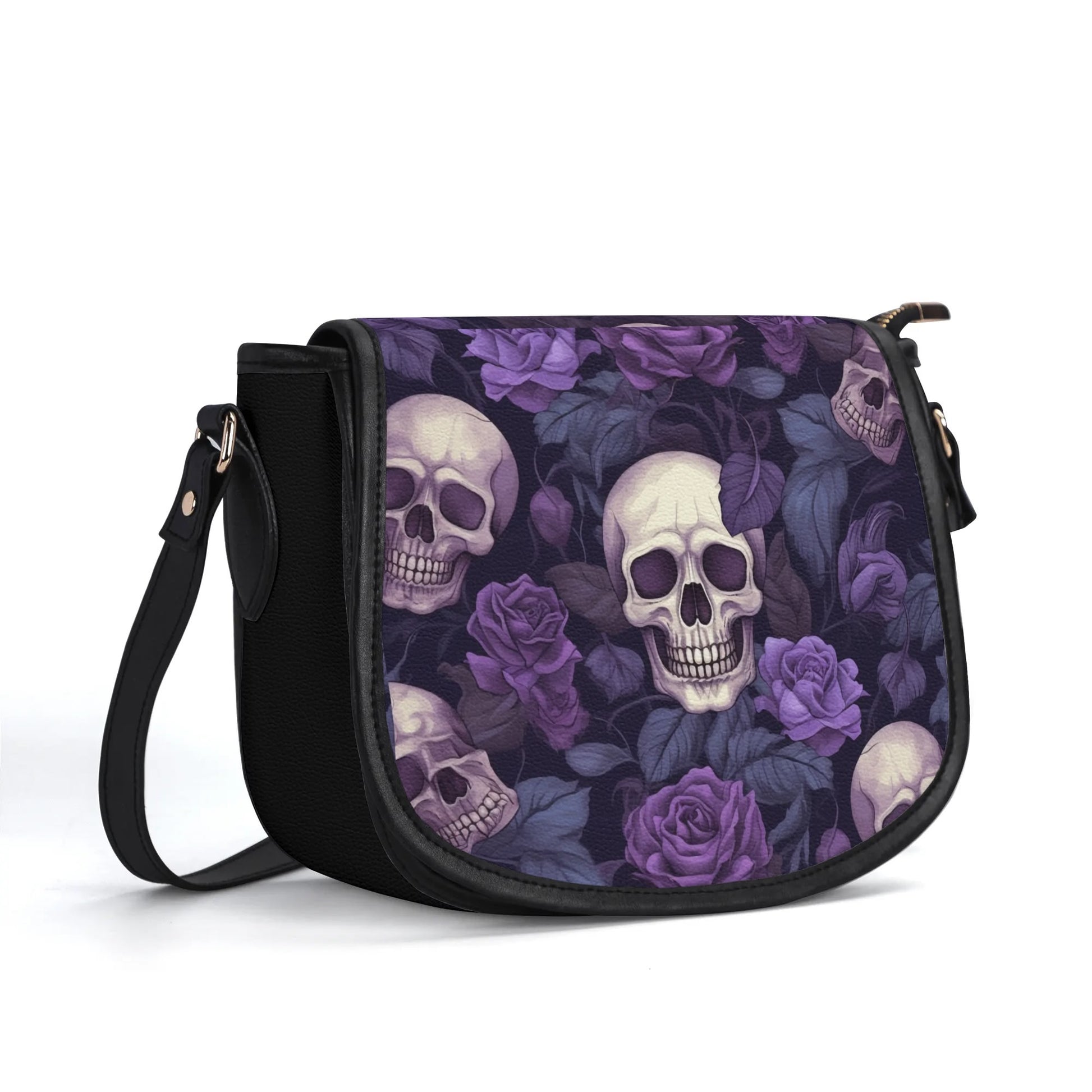 "Gothic Garden saddle handbag with skulls and purple flowers, secure closure, and adjustable strap."