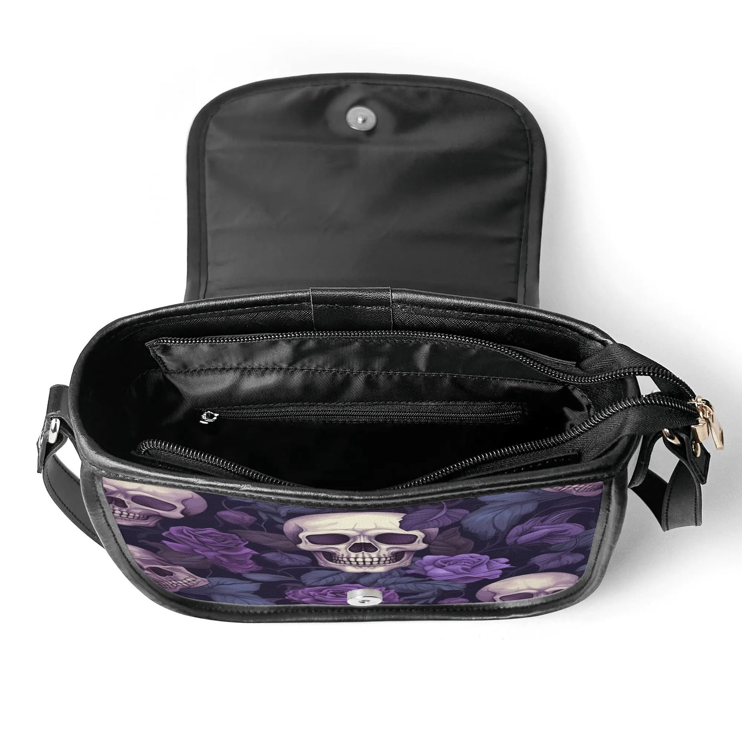 "Gothic Garden saddle handbag with skulls and purple flowers, secure closure, and adjustable strap."