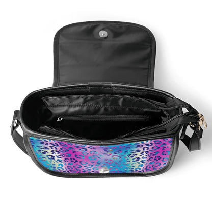 "Funky Leopard saddle handbag with vibrant abstract design, secure closure, and adjustable strap."