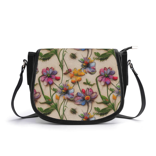 "Wildflower saddle handbag featuring a stunning 3D illusion of flowers, secure closure, and ample space."