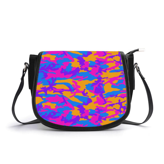 "Storm Camo saddle handbag with vibrant swirls of color, secure closure, and adjustable shoulder strap."