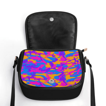 "Storm Camo saddle handbag with vibrant swirls of color, secure closure, and adjustable shoulder strap."