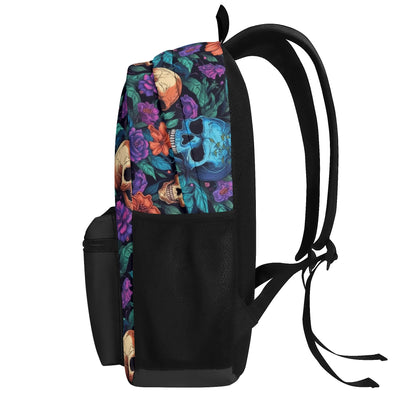 "Skull Garden Backpack features colorful flowers surrounding black and white skulls for an edgy look."