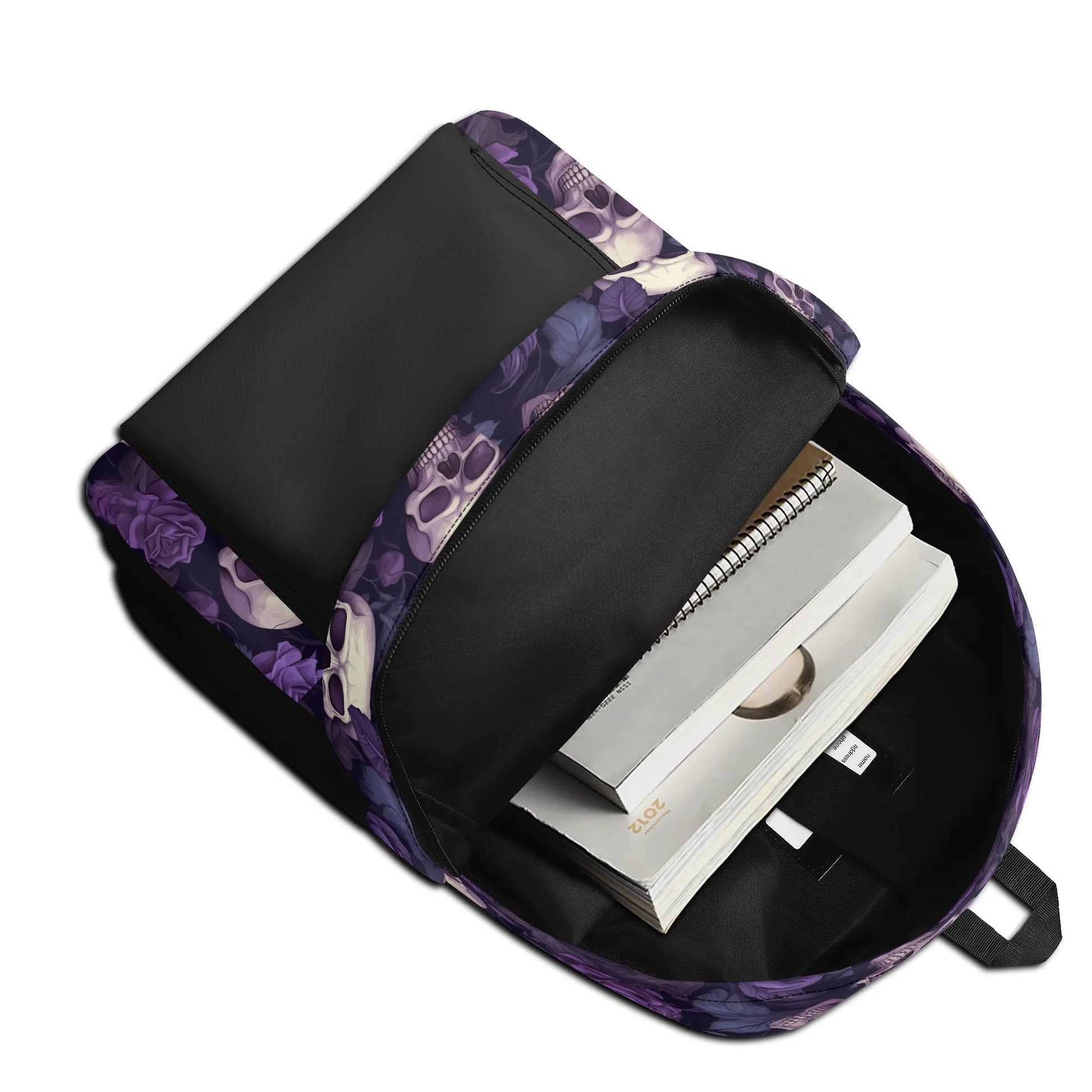 "Gothic Garden Backpack features black and white skulls adorned with bright purple flowers."