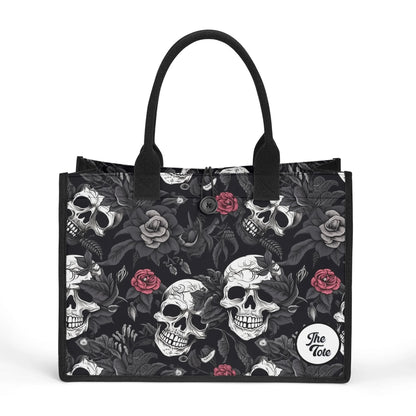 "Gothic tote bag showcasing black and white skulls with red roses, ideal for fashion lovers who embrace edgy styles."