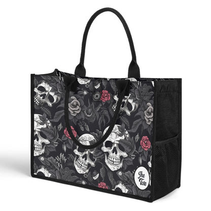 "Gothic tote bag showcasing black and white skulls with red roses, ideal for fashion lovers who embrace edgy styles."