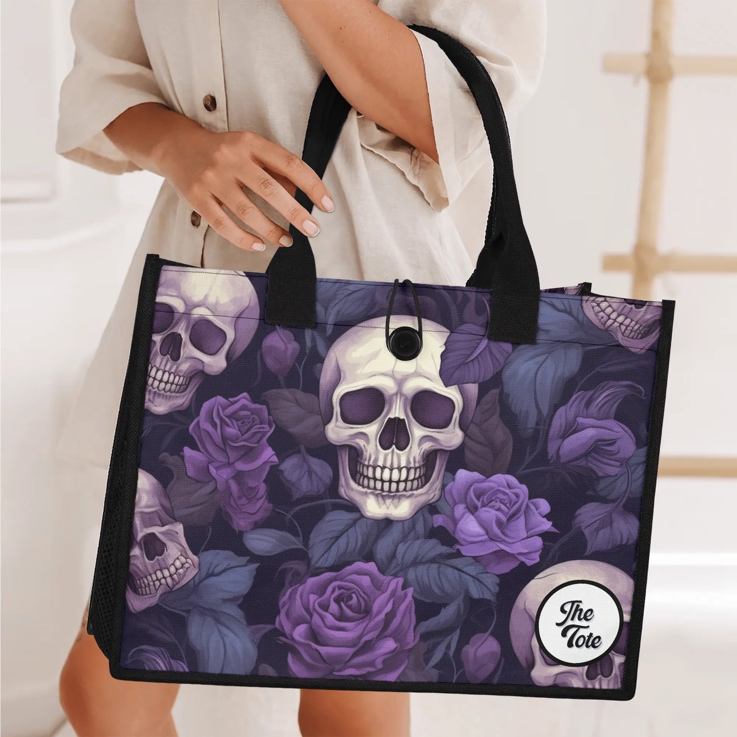 "Mix of black and white skulls with bright purple flowers on a tote bag by ShitHot, ideal for unique style."