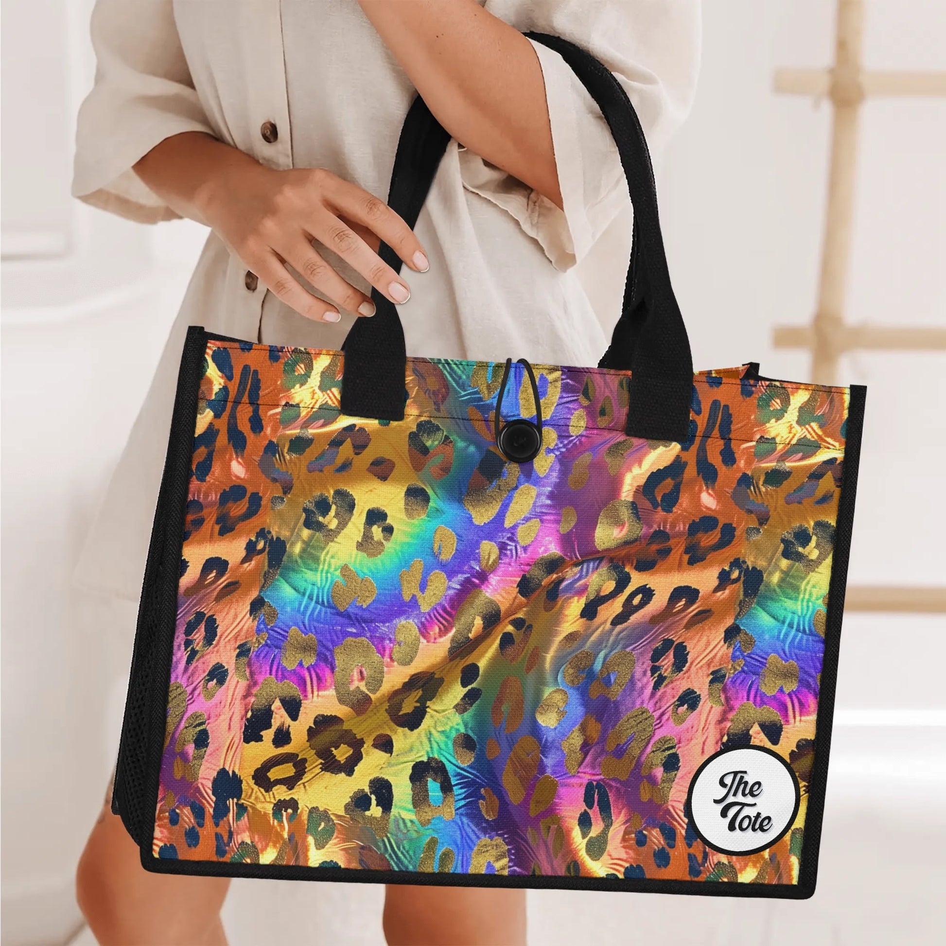 "Chic leopard print tote bag featuring a colorful background and shimmering gold spots, perfect for stylish outings."