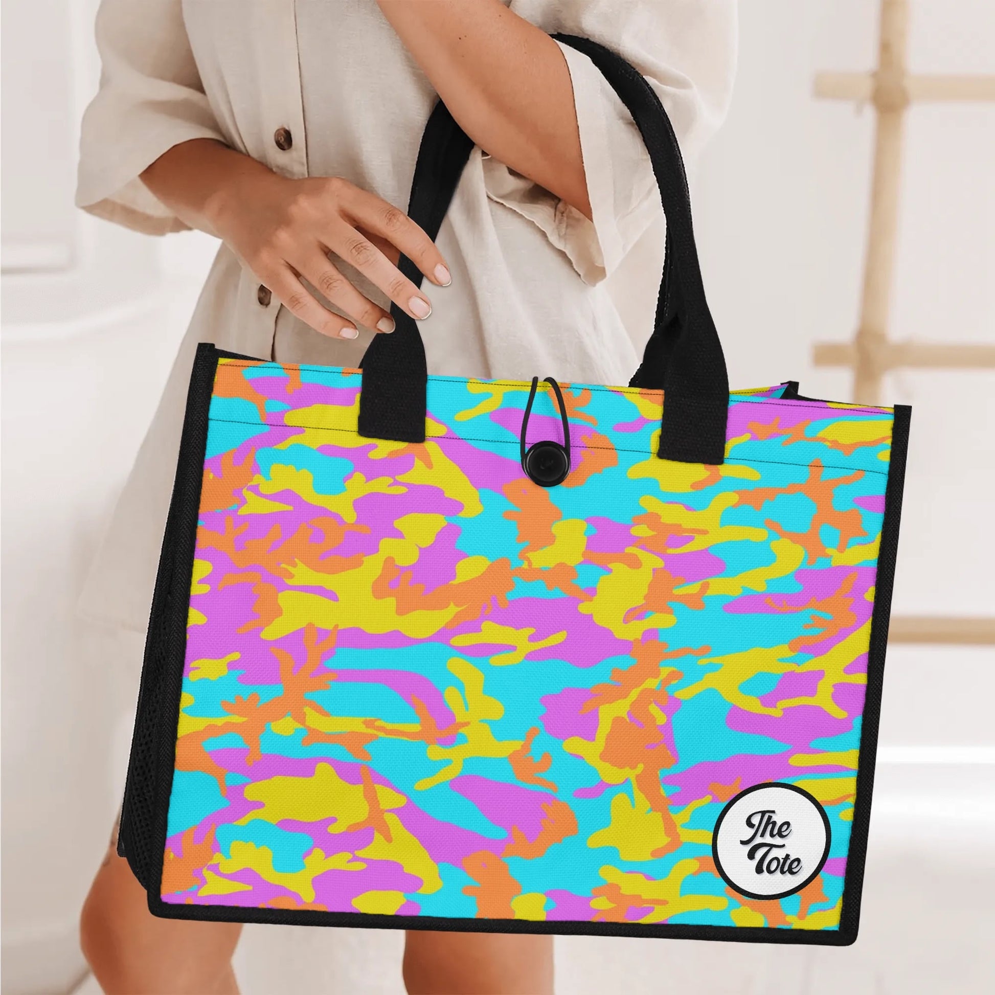 "Bright thunder camo tote bag with light blue, electric yellow, and fiery orange swirls, perfect for bold fashion lovers."