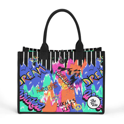 "Urban graffiti-inspired tote bag by ShitHot, blending black and white stripes with vibrant street art for bold style."