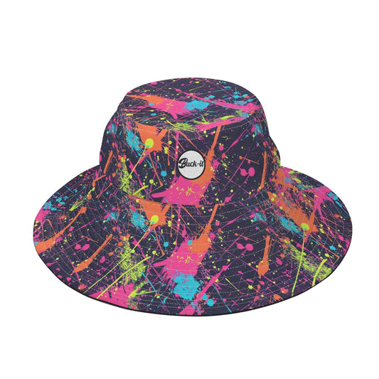 Paint Splat Bucket Hat featuring vibrant multicolor paint splatter design on black background with neon pink, orange, blue, and green splatters. Round white logo patch visible. Wide-brimmed sun protection style. Women's Collection, Women's Hat Collection, ShitHot Best Sellers.