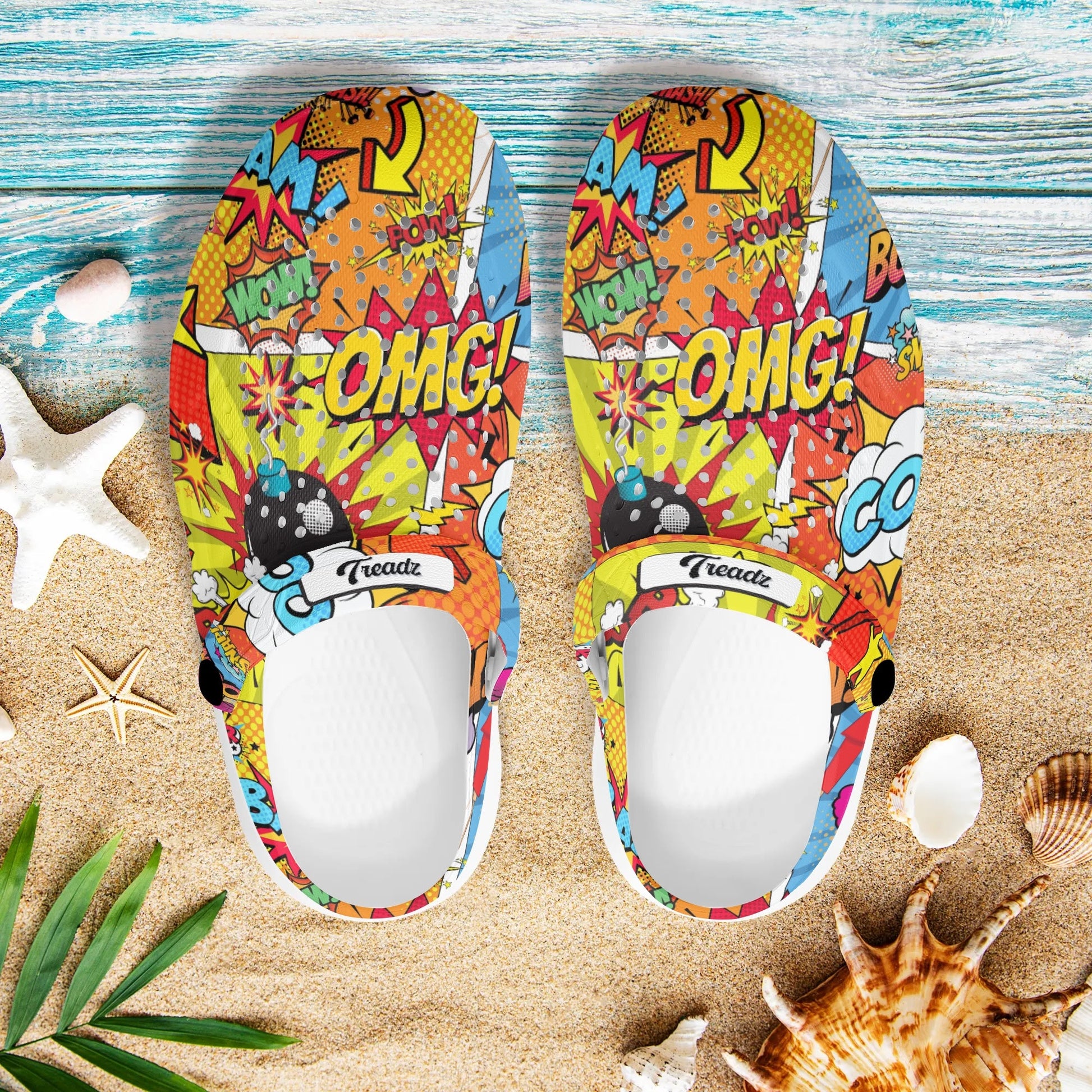 Treadz Clogs - The Comic by ShitHot. Vibrant comic-style print clogs by theshithotcompanyt, perfect for adding a playful pop to your daily look."