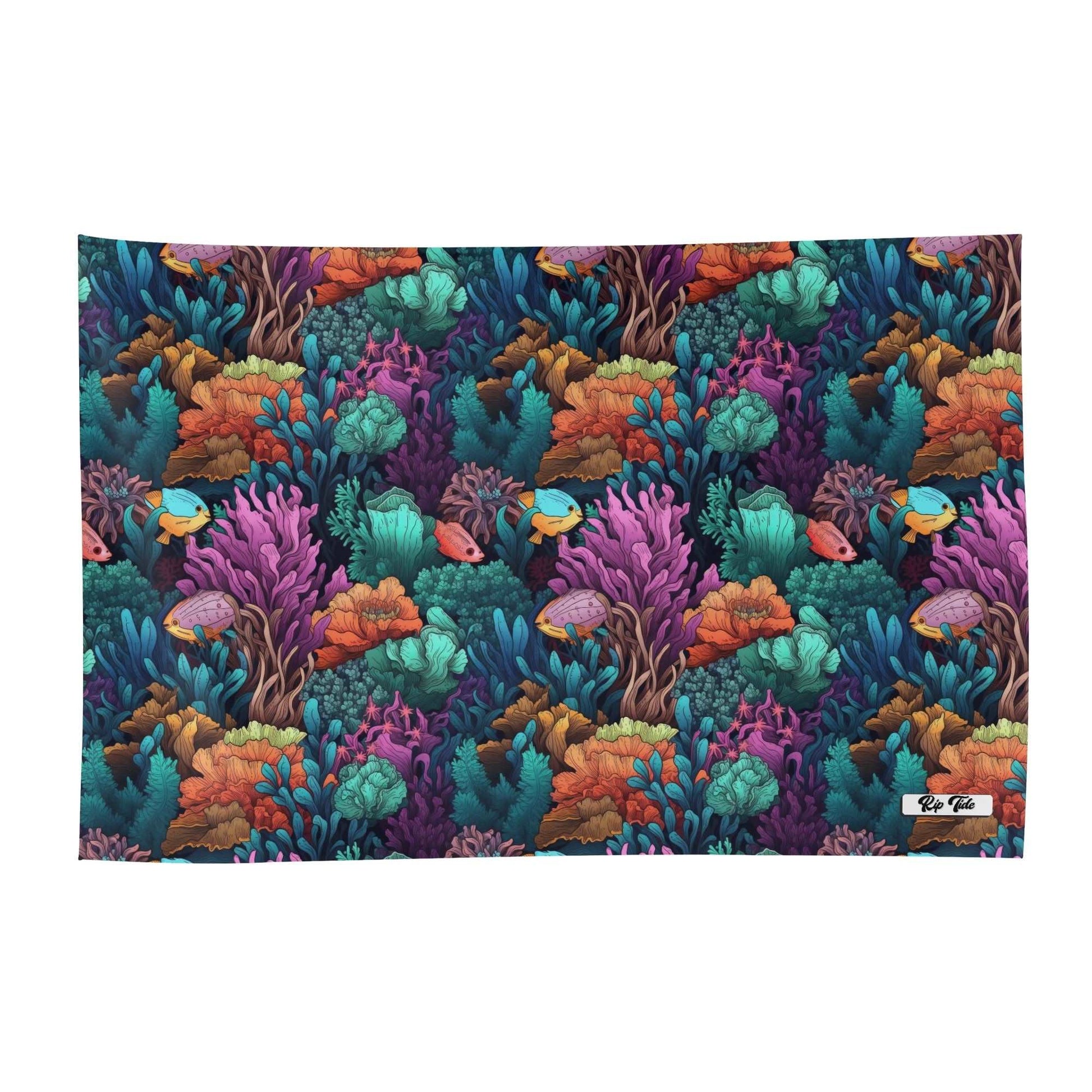 Barrier Reef Wrap Sarong featuring vibrant underwater pattern with colorful coral reefs in turquoise, purple, and orange, accented by tropical fish swimming through a repeating marine design on lightweight fabric