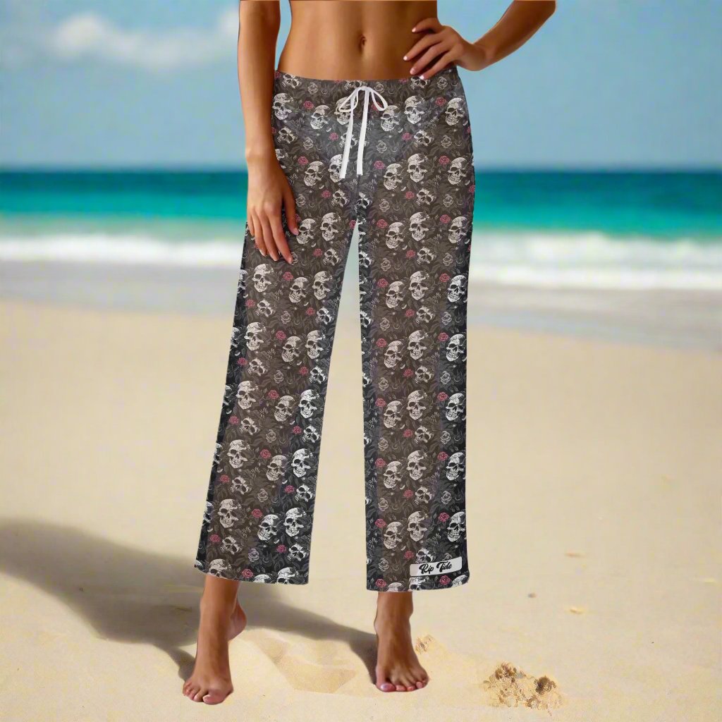 Rip Tide Beach Cover Up Pants – Skull Rebel by ShitHot: Bold skull and rose design, lightweight fabric, adjustable waist, edgy for beach or casual looks. theshithotcompany