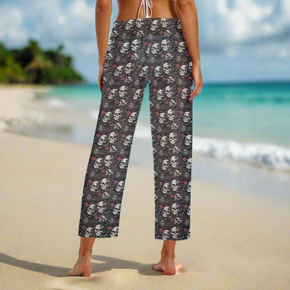 Rip Tide Beach Cover Up Pants – Skull Rebel by ShitHot: Bold skull and rose design, lightweight fabric, adjustable waist, edgy for beach or casual looks. theshithotcompany