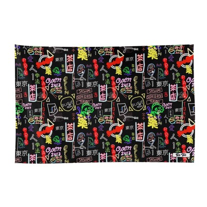 Akihabara Pulse Wrap Sarong featuring a vibrant black background with colorful neon-style Japanese characters, street signs, and symbols in pink, yellow, and red, creating a modern Tokyo nightlife pattern inspired by the electric atmosphere of Akihabara district