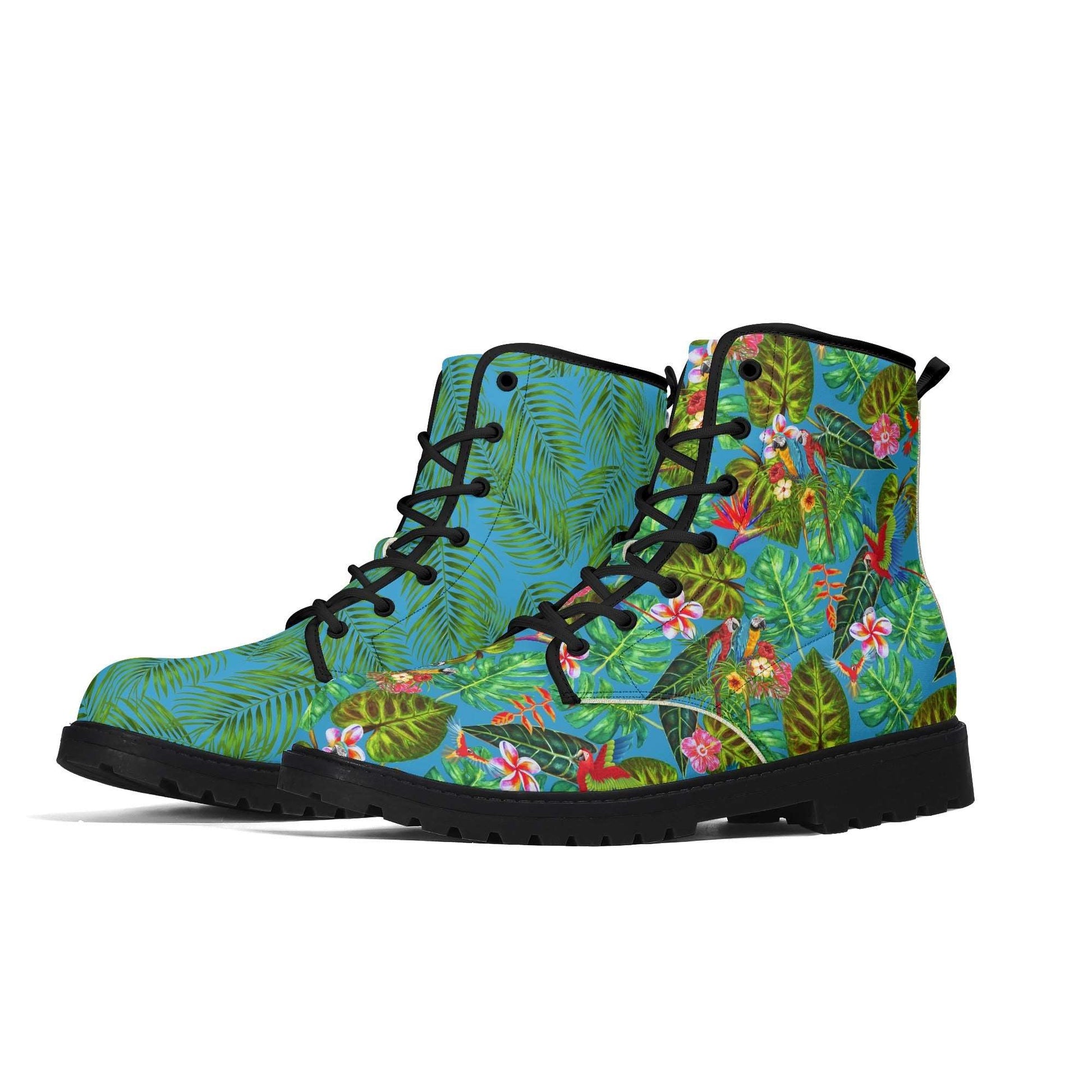 Treadz Men's Mismatch Signature Boots - Tropicana featuring mismatched tropical designs: palm leaves on blue on right boot, colorful birds and foliage on left, with black laces and soles, showcasing vibrant artistic patterns for unique style statement