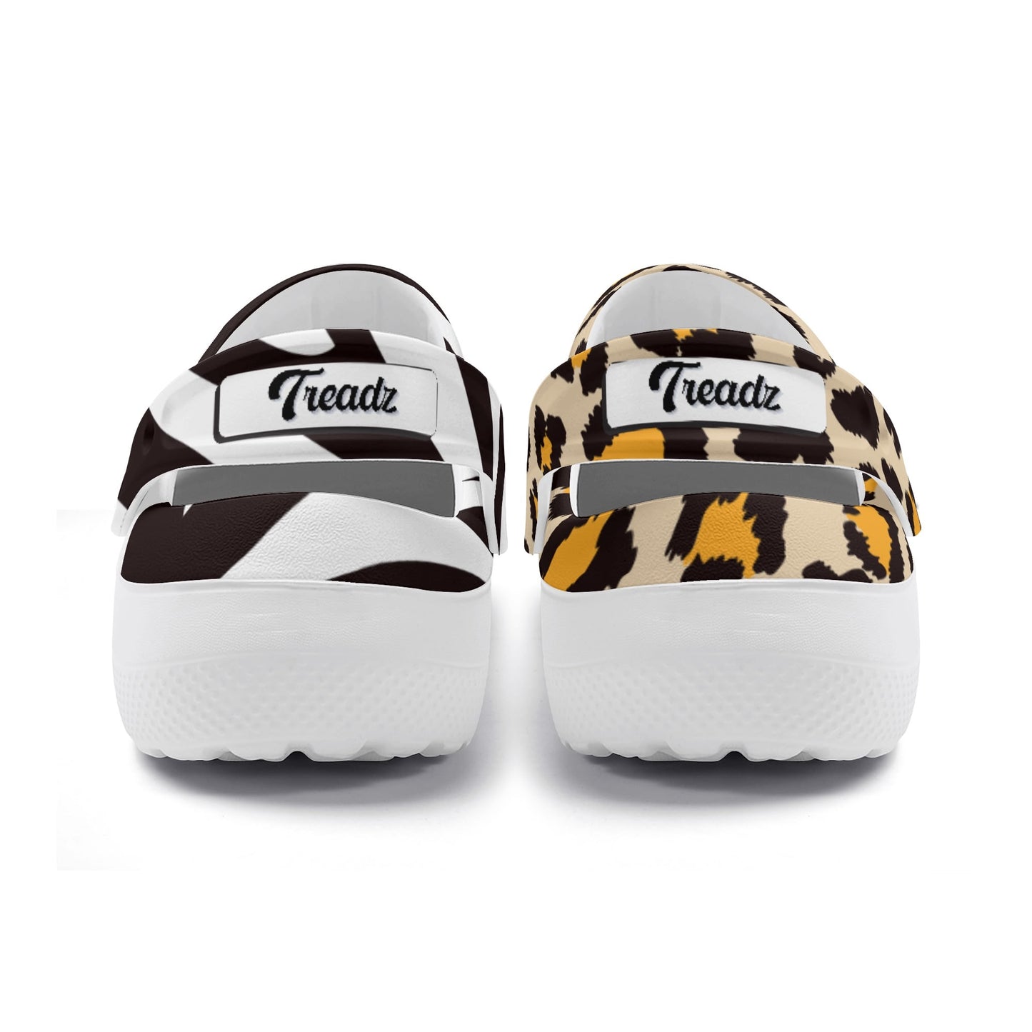 Treadz Nursing Slide On Mismatch Clogs - Safari featuring mismatched zebra and leopard prints, white rubber soles, closed-back design, with black Treadz logo on each shoe's upper strap