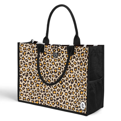 The Mismatch Tote Bag - Safari features a stylish design with leopard print pattern, black trim and handles, side mesh pockets, and sturdy canvas construction. Perfect for everyday use with ample storage space.