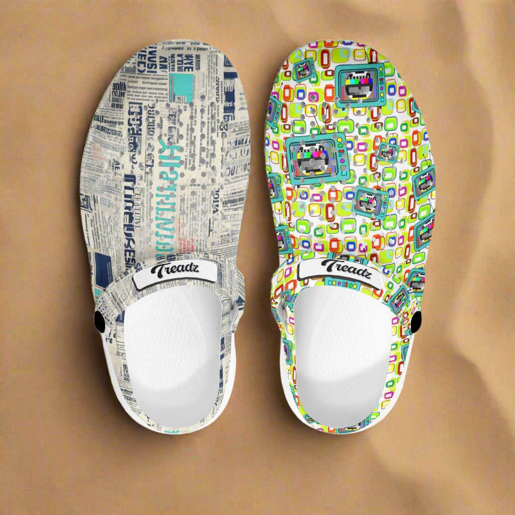 Treadz Mismatch Clogs - Retro Media featuring mismatched design: one clog with vintage newspaper print and one with colorful retro test pattern, displayed on beach-themed background with seashells and sand