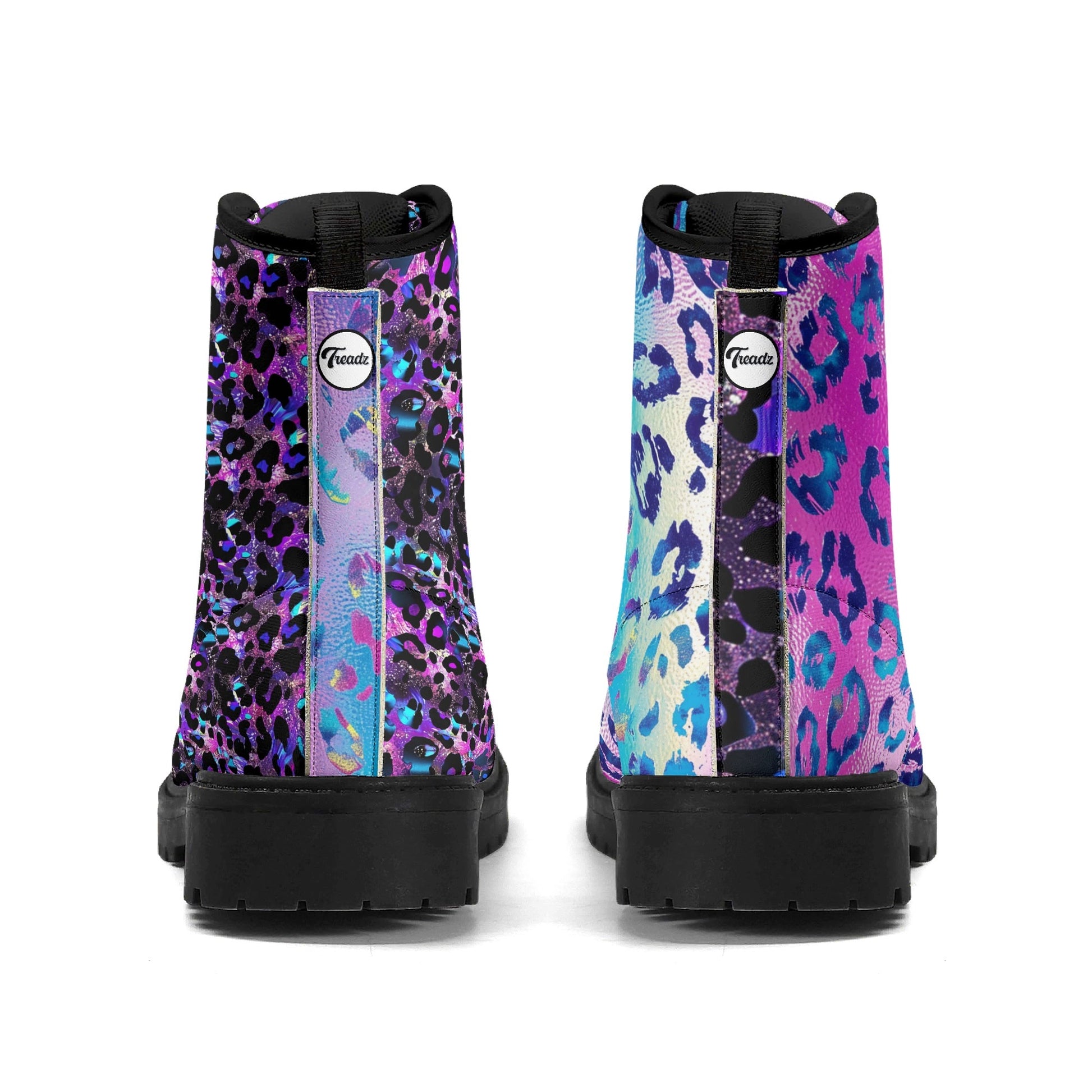 Galaxy Leopard Mismatched Combat Boots featuring unique split-color design: left boot in purple cosmic leopard print, right boot in blue-pink galactic leopard pattern. Black combat boot soles and trim. Eco-friendly vegan leather ankle boots with platform sole - ShitHot Best Sellers, Women's Boot Collection.