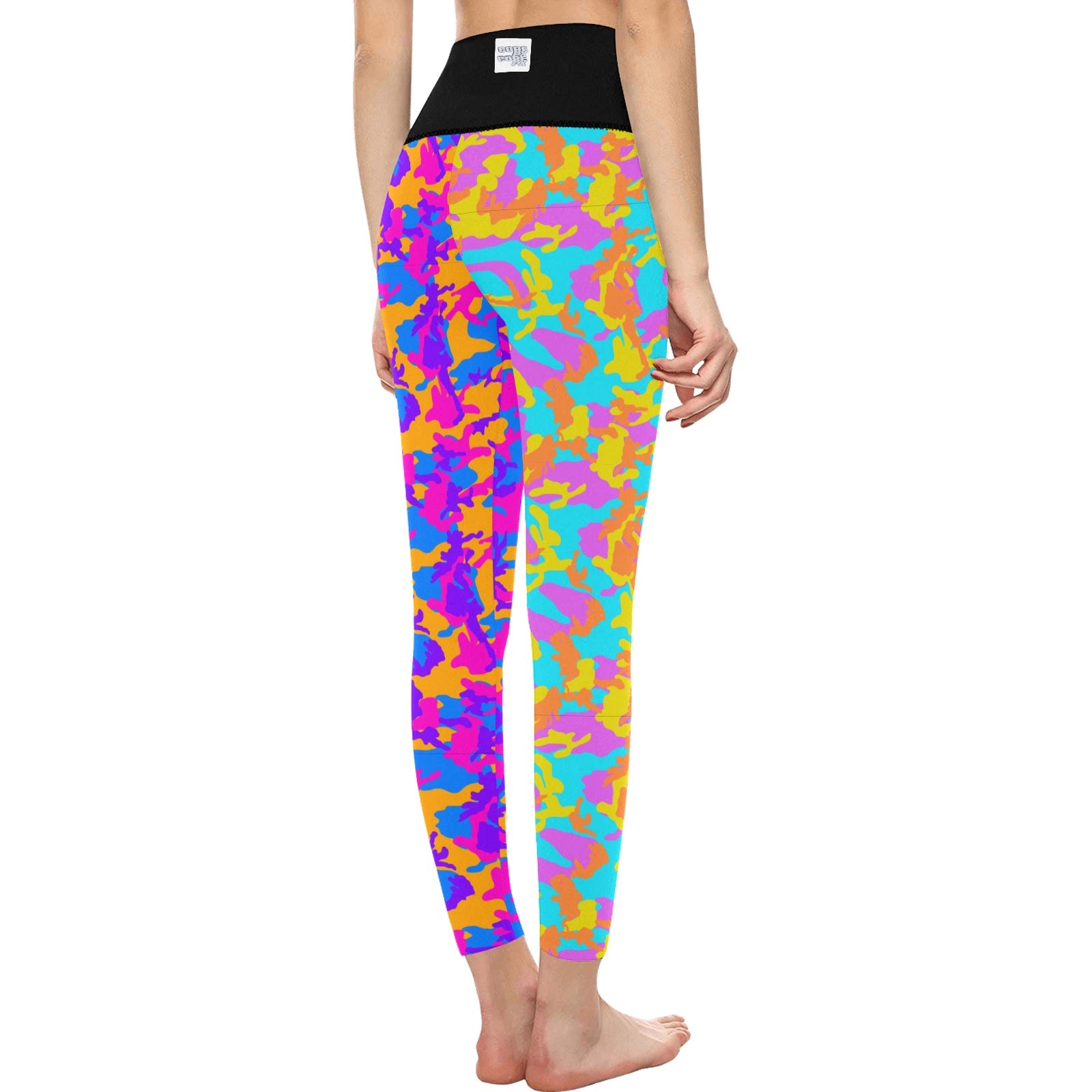 High Waisted Mismatch Core FX Mismatch Leggings - Camo shown from behind, featuring vibrant multicolored camo print pattern in neon orange, pink, purple, and turquoise with a black high-rise waistband. Form-fitting athletic wear displayed in a standing pose.