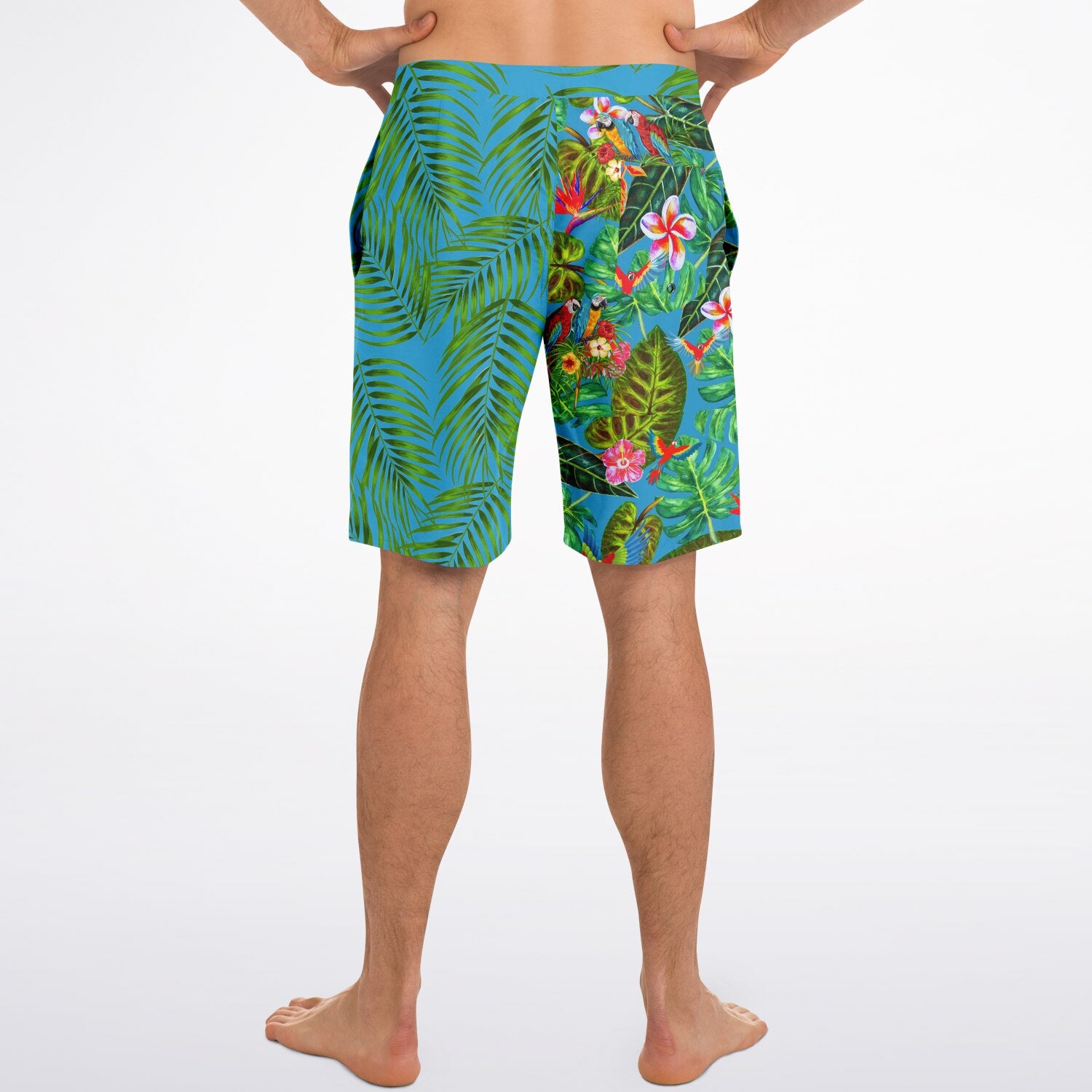 RipTide Men's Mismatch Board Shorts - Tropicana featuring split design with green palm leaves on blue side and vibrant tropical foliage with birds on turquoise side, elastic waistband with mesh-lined pockets