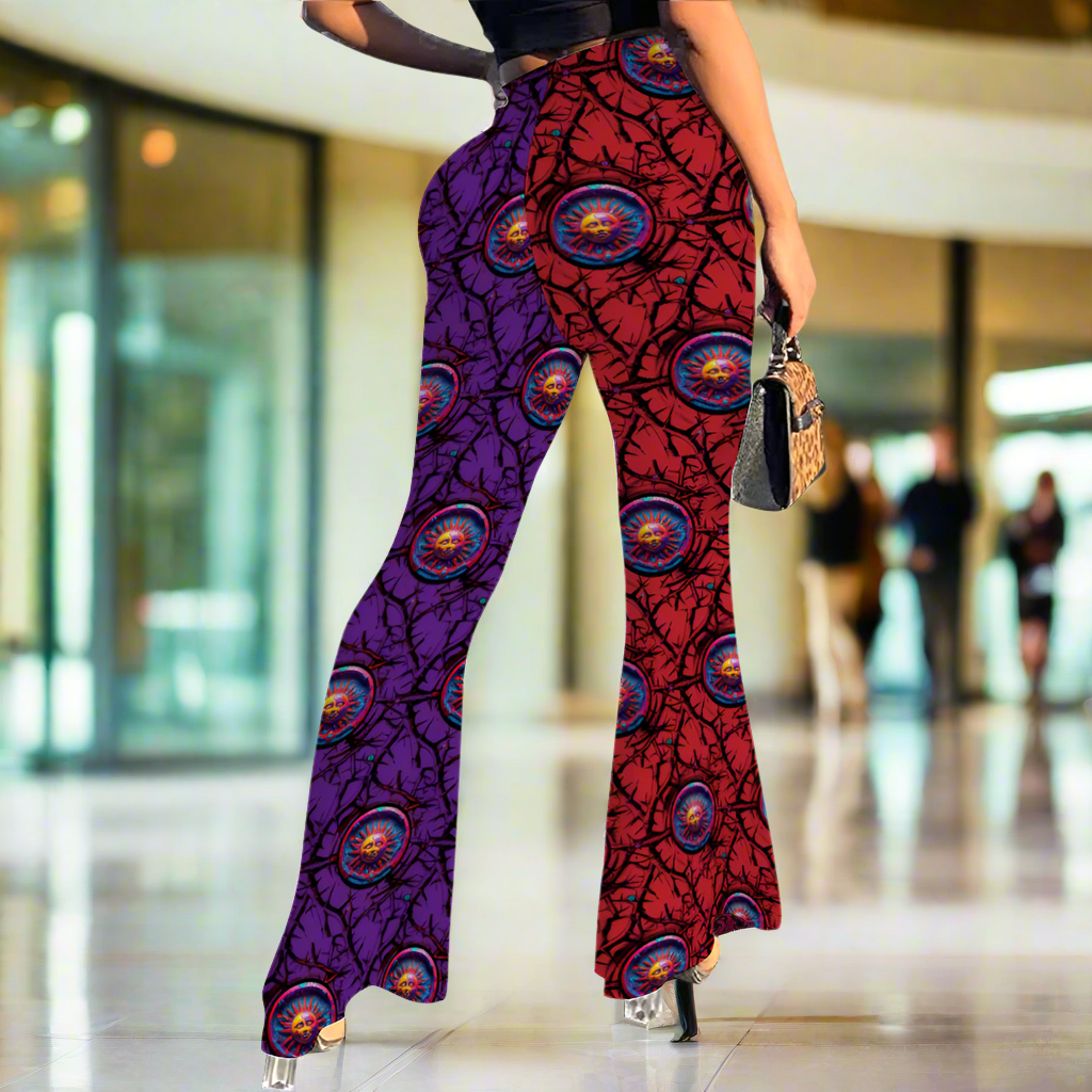 Stretch Bell Bottom Flares featuring vibrant red and purple split pattern with circular medallion prints, high-waisted design with dramatic flared legs. Black top and handbag visible in styling. Perfect for casual and dressy occasions.