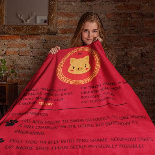 Red sherpa fleece blanket featuring golden Pig zodiac design with traditional Chinese border pattern. Text displays Pig zodiac traits and years against vibrant red background. Luna New Year Zodiac Dog Blanket - PIG from ShitHot Best Sellers, Luna New Year Horoscope Blankets collection.