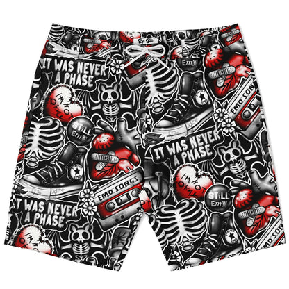 Rip Tide Men's Board Shorts featuring edgy black and white skeleton pattern with red accents, retro cassette tapes, and emo-inspired graphics. Quick-dry swim trunks with elastic waistband, mesh-lined pockets, and bold text saying "It Was Never A Phase" throughout the design.